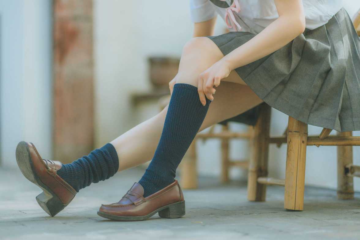 Woman pulling up compression socks