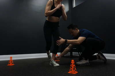 Sports Chiropractor conducting movement assessment
