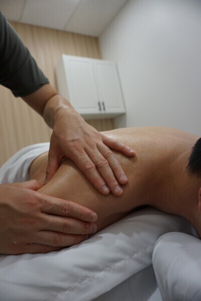 Registered Massage Therapist conducting massage treatment on patient